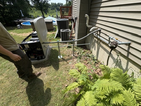 An outdoor AC condenser replacement in progress at a Niles, MI area home