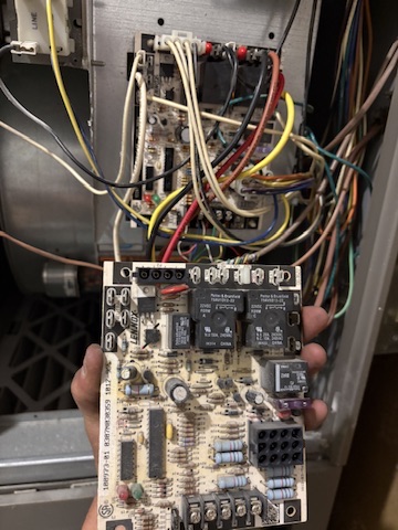 A furnace control board being replaced during a repair at a Niles, MI area home