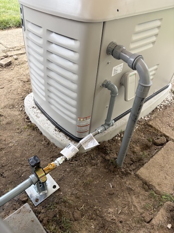 The gas line connection run to a Generac standby generator during installation